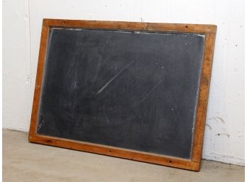 An Antique Slate Board In Oak Frame