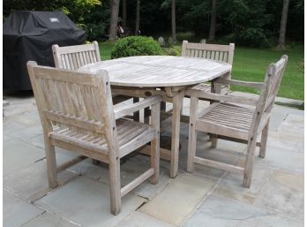 An Outdoor Teak Table And Chairs By The Anacara Company