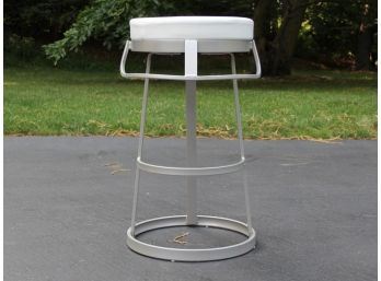 A Modern Metal Sculptural Bar Stool With Leather Seat