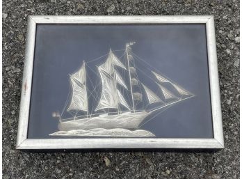 A Silver Sailboat Sculpture