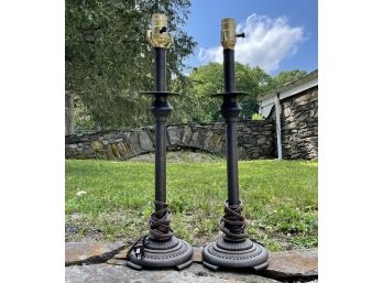 A Pair Of Bronze Tone Stick Lamps