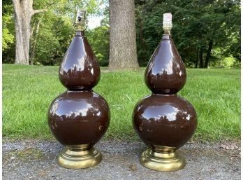 A Pair Of Ceramic Lamps On Brass Bases