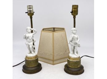 A Pair Of Vintage Cherub Form Lamps On Brass Bases