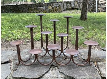 A Large Wrought Iron Candle Holder