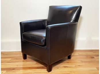 An Arm Chair In Dark Chocolate Patent Leather By Crate & Barrel