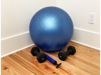 A Swiss Ball, Inflator, And Weights