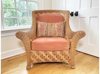 A Vintage Wicker Chair With Designer Cushions