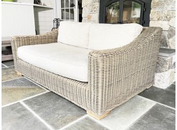 A Wicker Indoor/Outdoor Sofa With Linen Cushions And Outdoor Covers By Restoration Hardware