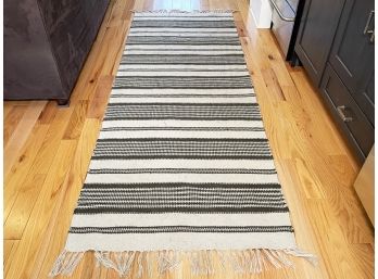 A Natural Woven Rug By Pottery Barn