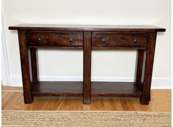 A Reclaimed Hardwood Console Table With Wrought Iron Hardware By Pottery Barn