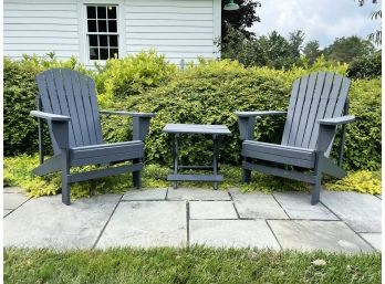 A Pair Of Painted Wood Adirondack Chairs And A Folding Cocktail Table