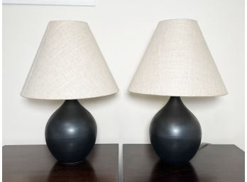 A Pair Of Modern Ceramic Lamps With Linen Shades