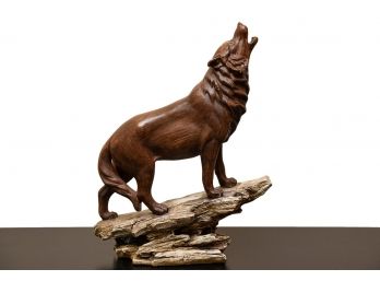 Carved Wood Howling Wolf Sculpture On Tree Bark