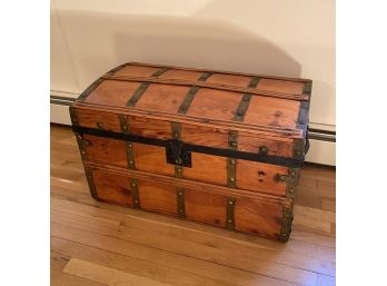 Refinished Antique Trunk With Brass Straps And Quilted Interior