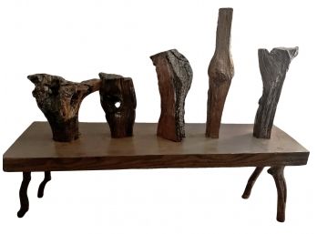 Natural Wood Sculpture Set On A Bench