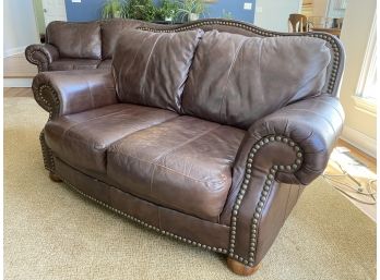 Two Seat Leather Loveseat W Nail Head Trim And Bun Feet