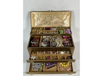 A LARGE JEWELRY BOX FULL OF COSTUME JEWELRY