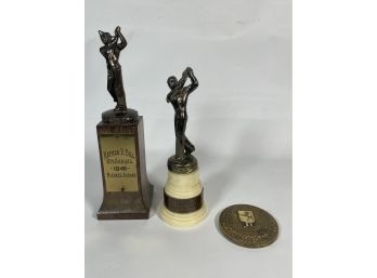 2 GOLF TROPHYS AND A 1941 BRITISH WAR RELIEF MEDALLION