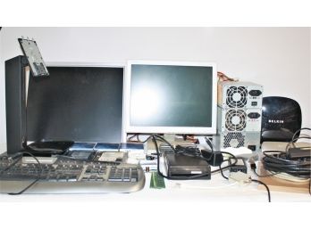 Lot Of Computer Accessories Including Monitors, Stands, Hard Drives, Wires, Routers, Etc