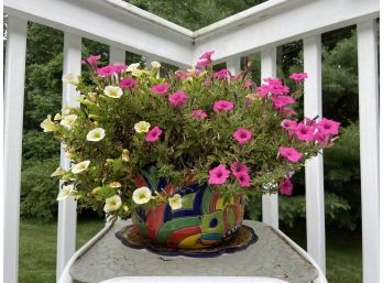 Flowers In Planter On Small Side Table