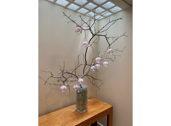 Glass Vase Filled With Glass Rocks, Large Branch, And Decorative Lanterns