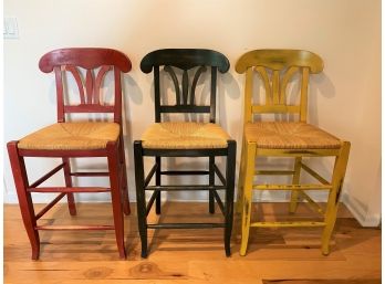 Group Of Three Intentionally Distressed Wood Stools With Rush Seats And Seat Cushions