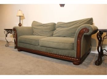 Green Two Cushion Sofa With Carved Wooden Detailing By Distinctions