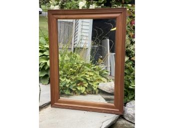 A Wood-Framed Mirror