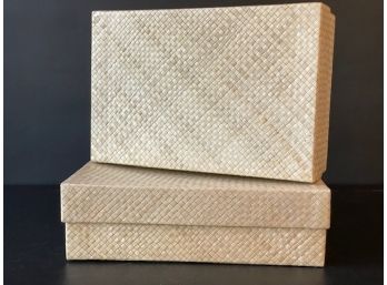 A Pair Of Woven Storage Boxes