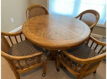 Round Oak Table With Leaf & Four Cane Back Chairs On Wheels