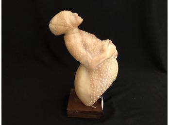 Carved Stone Fertility Figure With Wood Base