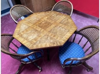 Solid Wood Octagon Table And Four Cane Back Swivel Rolling Chairs