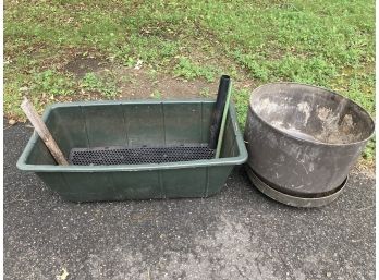 One Large Green Self Watering Garden Box And A Large Circular Pot