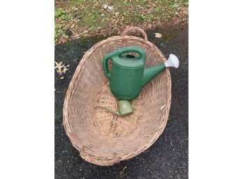 Two Watering Cans And A Large Basket