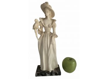 A Resin Figurine A Woman With A Parrot By A. Santini