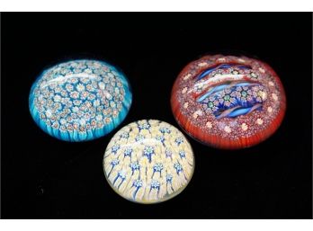 Three Primary Colored Floral Glass Paperweights