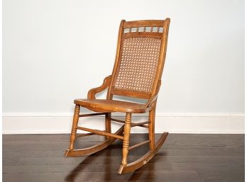 A Vintage Oak And Cane Rocking Chair - SCARSDALE - FARLEY RD.