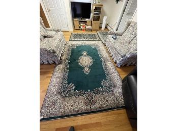 THREE CONTEMPORARY GREEN AND BROWN PERSIAN RUGS