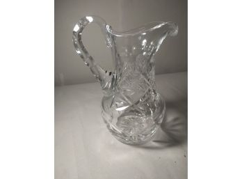 Ornately Carved Glass Pitcher