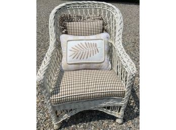 White Wicker Chair With Beige Cushions