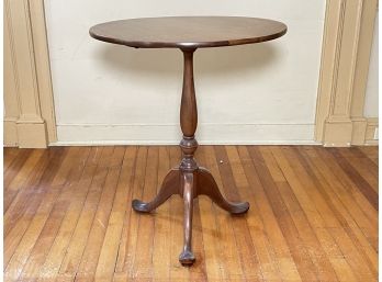 An Antique Mahogany Tilt Top Occasional Table