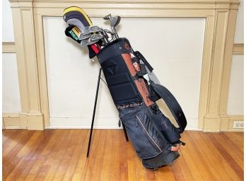 A Taylor Made Golf Bag And Assorted Clubs