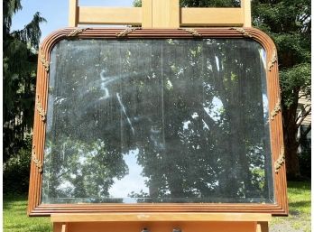 An Antique Beveled Mirror In Reeded Oak Frame