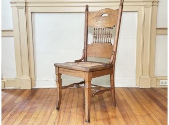 A Victorian Carved Oak And Cane Side Chair