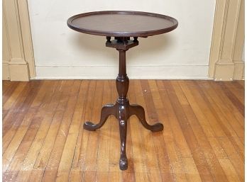 An Antique Mahogany Tilt Top Occasional Table