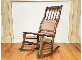 An Antique Cane And Tole Painted Rocker