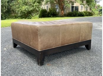 A Modern Tufted Leather Ottoman