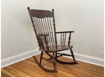 An Antique Carved Oak Spindle Back Rocking Chair