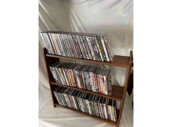 Collection Of 140 NEW/SEALED Assorted Genre DVDs On Wooden Shelf