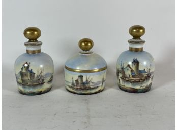 A HAND PAINTED LIMOGES COLOGNE AND POWDER JAR SET